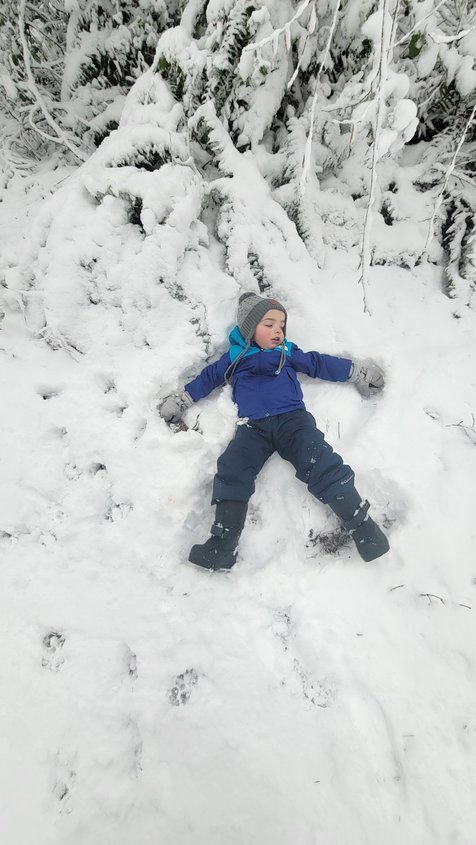 Three-year-old James makes a snow angel in View in this photo taken by Sarah Cody.