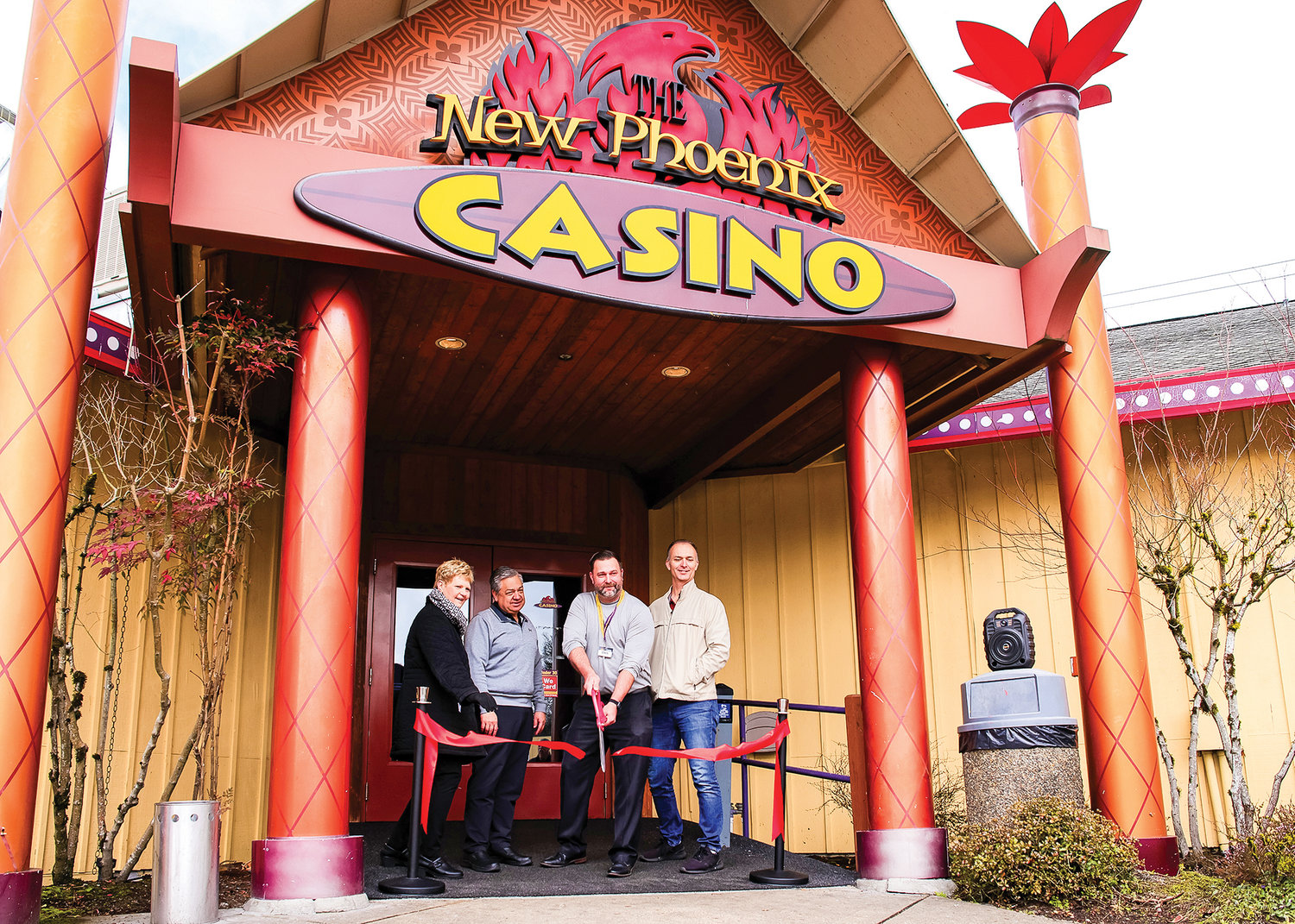 The ribbon is cut at The New Phoenix Casino by General Manager Chris Swindell, Wednesday, March 1. .Left to right; La Center Mayor Pro Tem Elizabeth Cerveny, President Victor Mena, General Manager Chris Swindell, Owner Bob Clark