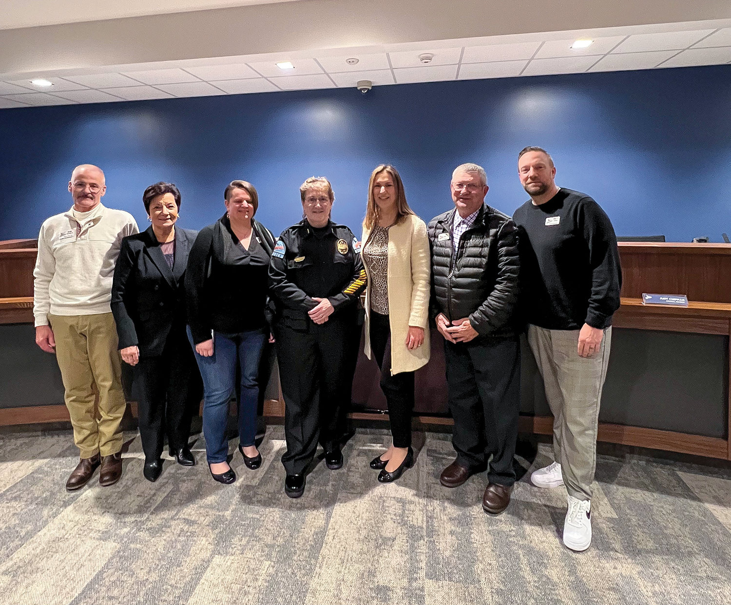 Ridgefield City Council members stand next to the city’s newly sworn-in city Police Chief Cathy Doriot in the city council chambers on March 9.