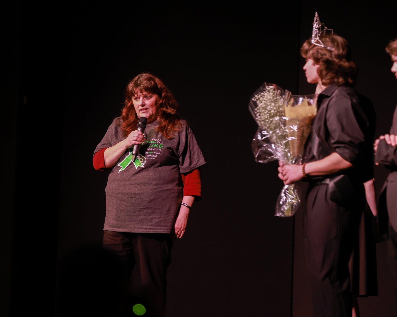 A family member of Luke Montei speaks to the crowd at the end of the Best of BG charity pageant at Battle Ground High School on Saturday, March 25.
