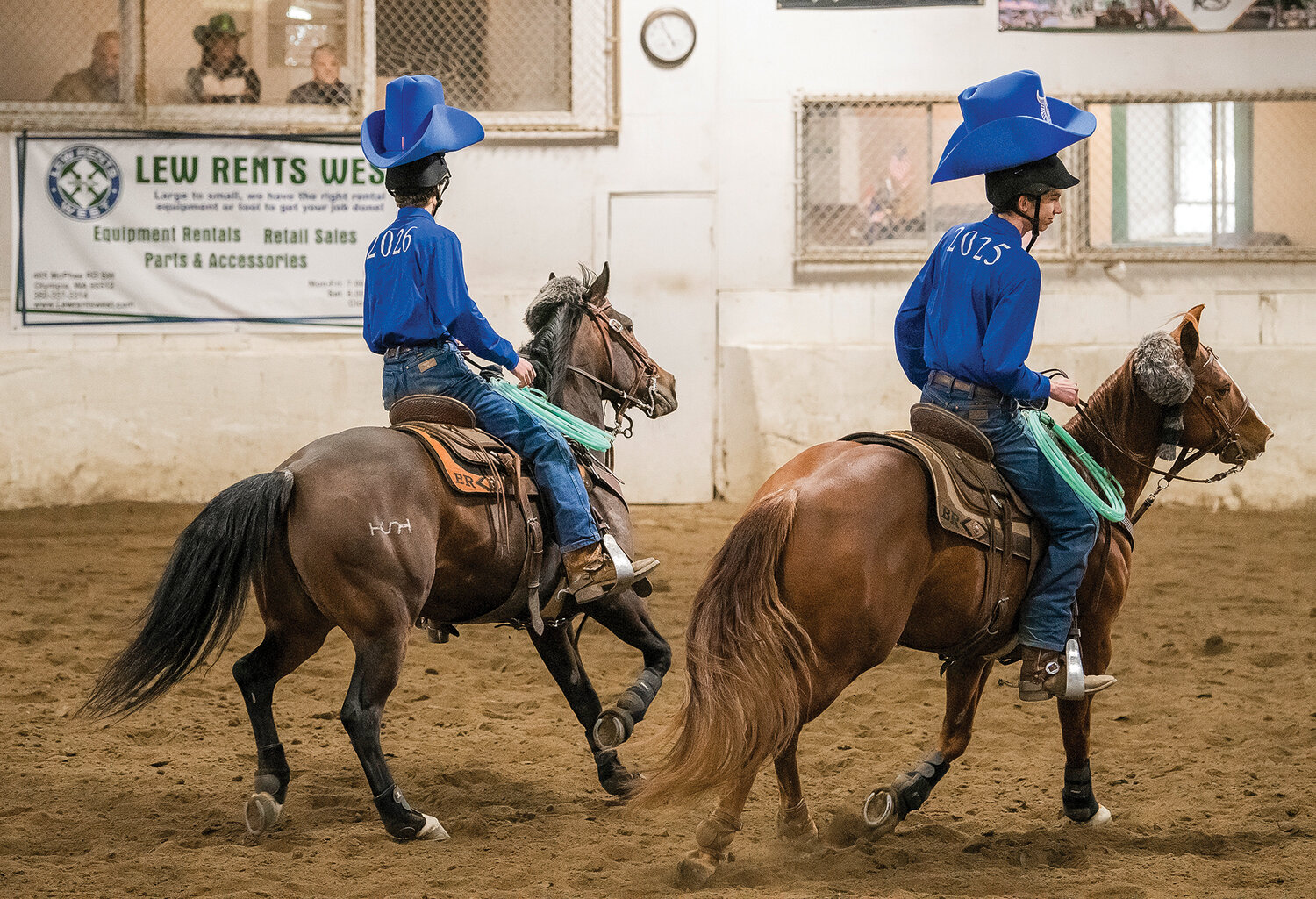 Hockinson juniors Braden and Trent Roth, who are twins, sport big goofy cowboy hats for a “working pairs” costumed performance in Tacoma on Saturday, April 15 for the team’s final district meet of the season.