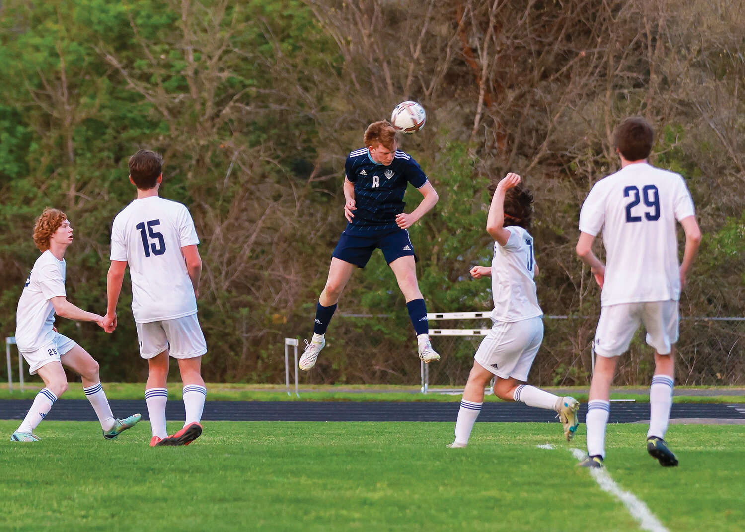 Hockinson's Igor Povazhniuk heads the ball over four Mark Morris defenders during the team's 7-0 victory on Tuesday, May 2.