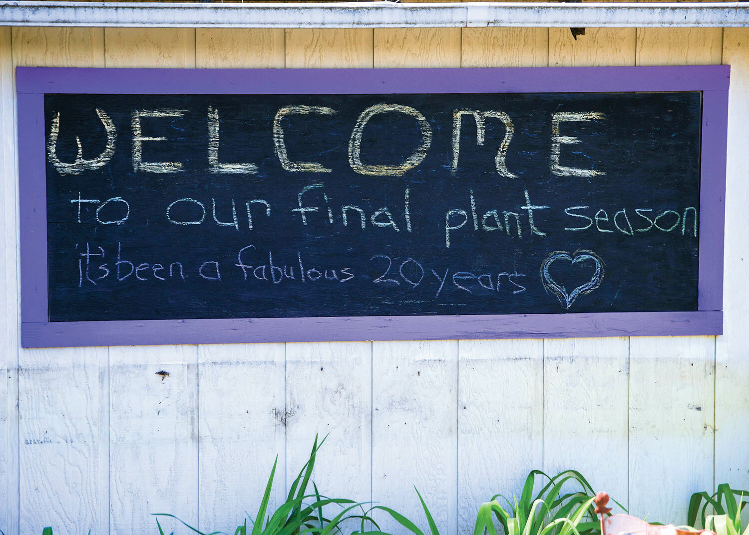 A sign on the side of the gift shop at Scented Acres announces the final plant season of the season on Wednesday, May 10.
