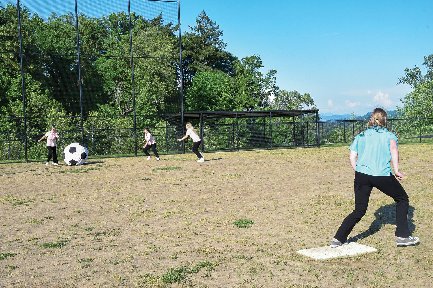 The Woodland Planters Days court plays a game of kickball at the in-progress softball and little league field during an open house at the park on May 18.