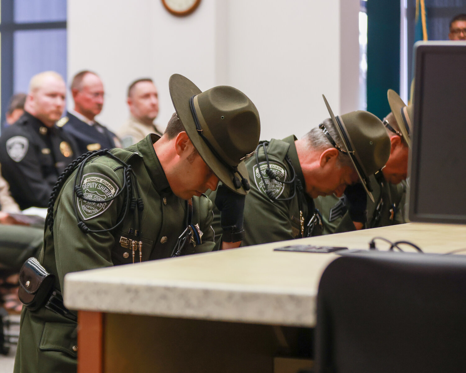 Members of the Clark County Sheriff's Office Honor Guard kneel during the bell ceremony during the Clark County Law Enforcement Memorial Ceremony in Vancouver on Thursday, May 18.
