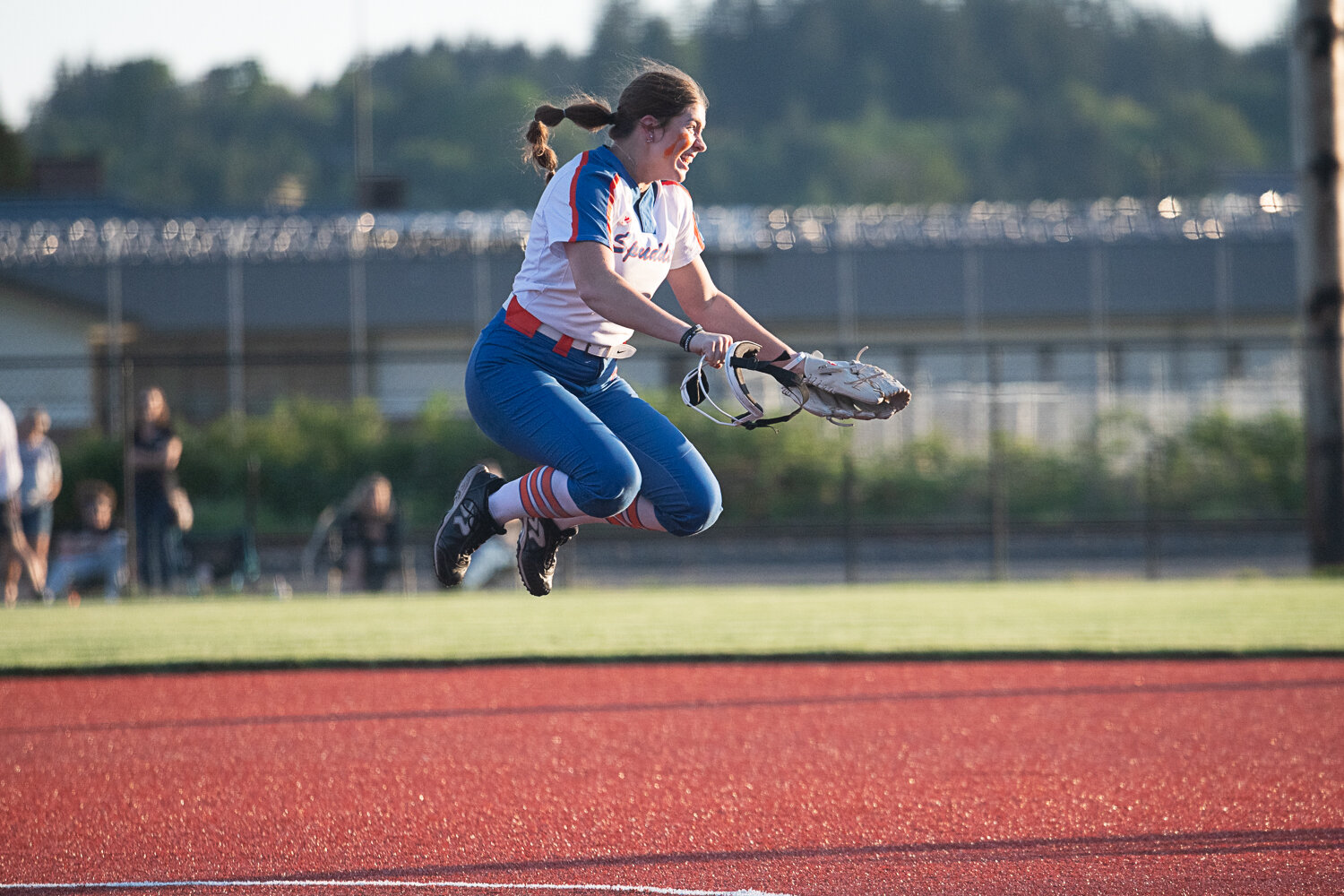Elizabeth Peery jumps for joy after the final out of Ridgefield's 4-3 win over Tumwater in the semifinals of the the 2A District 4 tournament on May 18 at Rec Park in Chehalis.