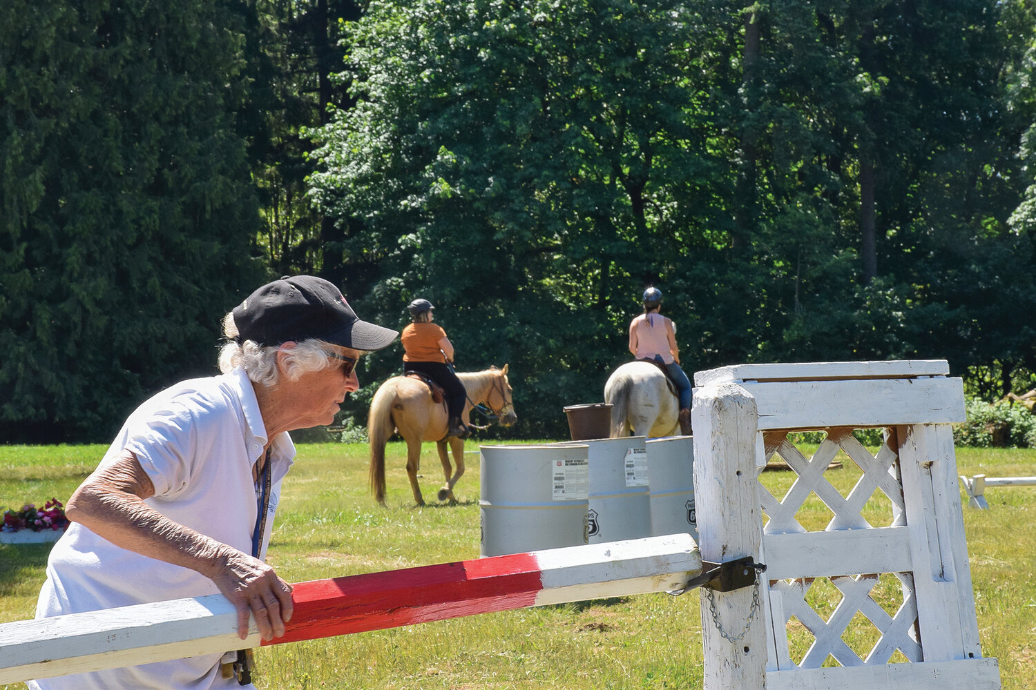 Fran Duncan adjusts an obstacle during the Clark County Saddle Club’s trail course event on June 3.