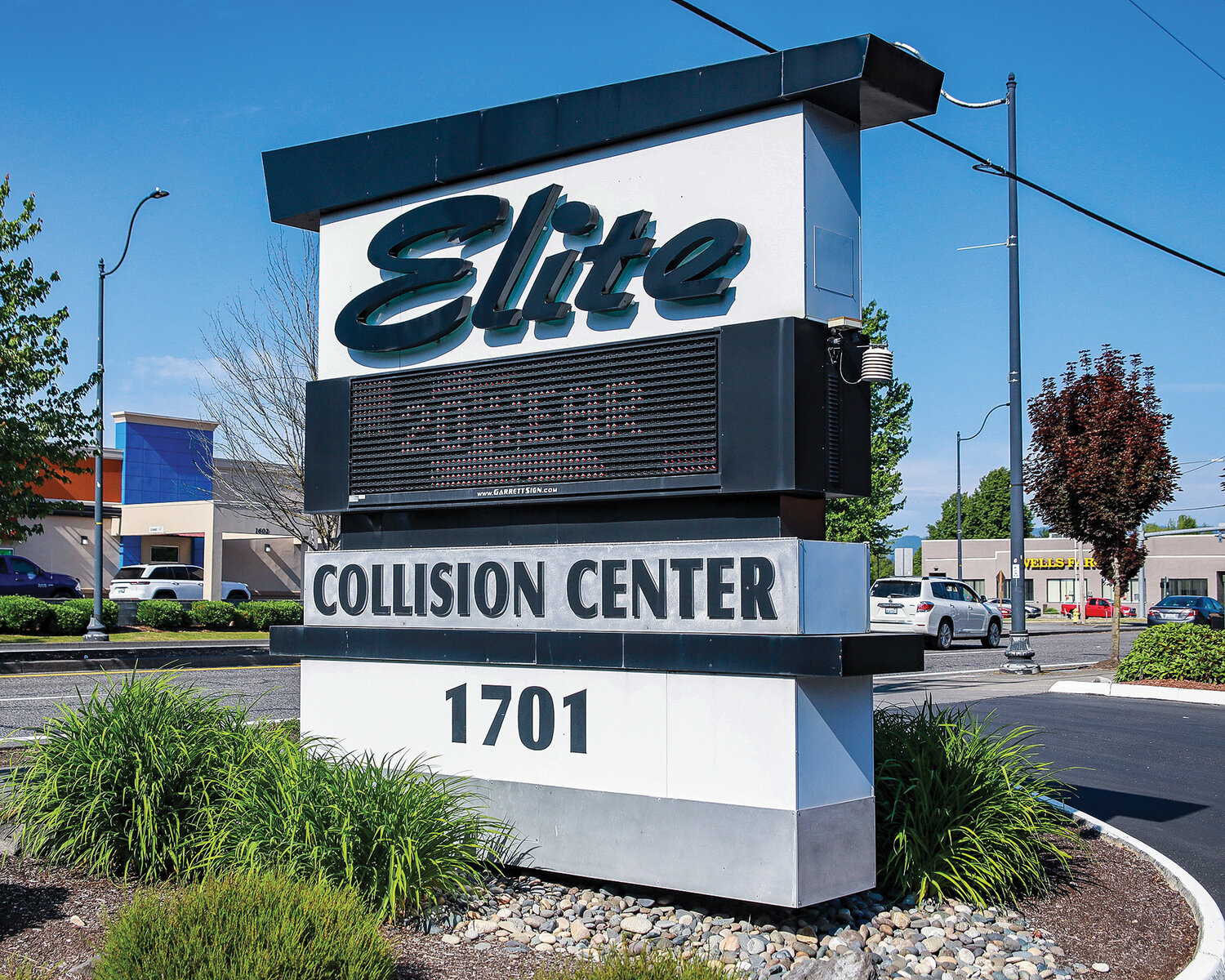 Elite Collision Center's sign off of Main Street in Battle Ground is seen showing its 20 year anniversary during the celebration on Wednesday, June 7.