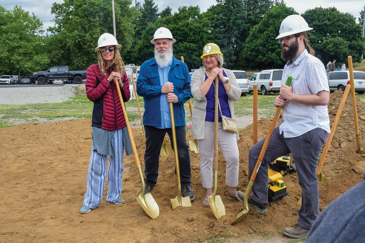 Woodland Community Library employees pose for a photo during the groundbreaking of the new library on June 17.