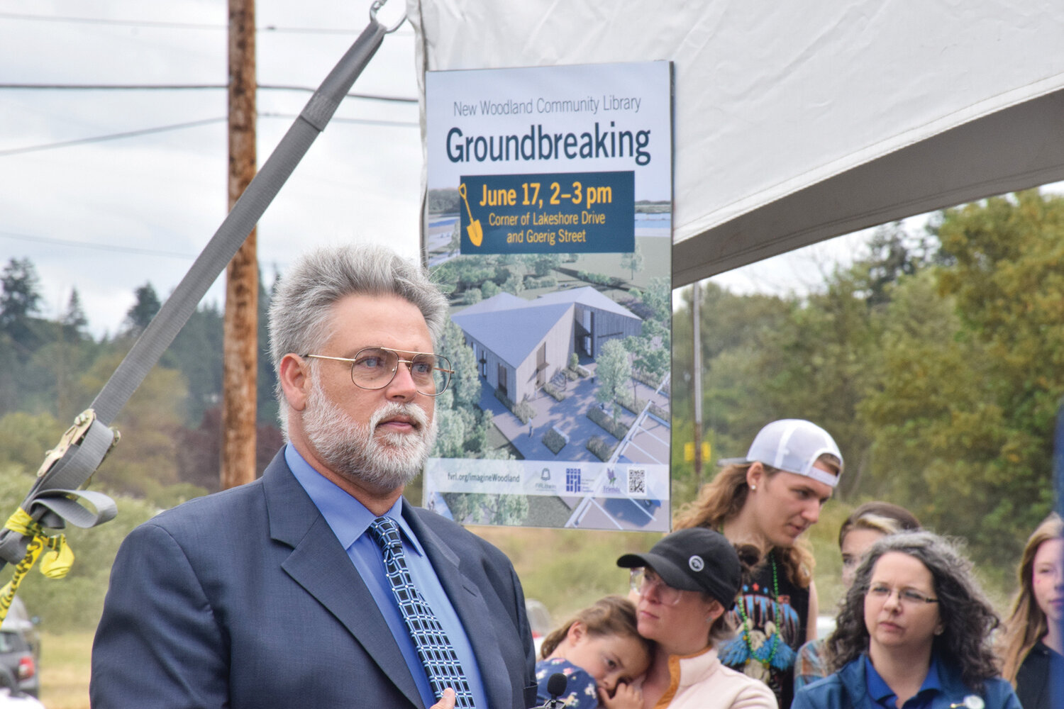 Washington State Rep. Ed Orcutt, R-Kalama, left, speaks among a crowd gathered for the  groundbreaking of the Woodland Community Library on June 17.