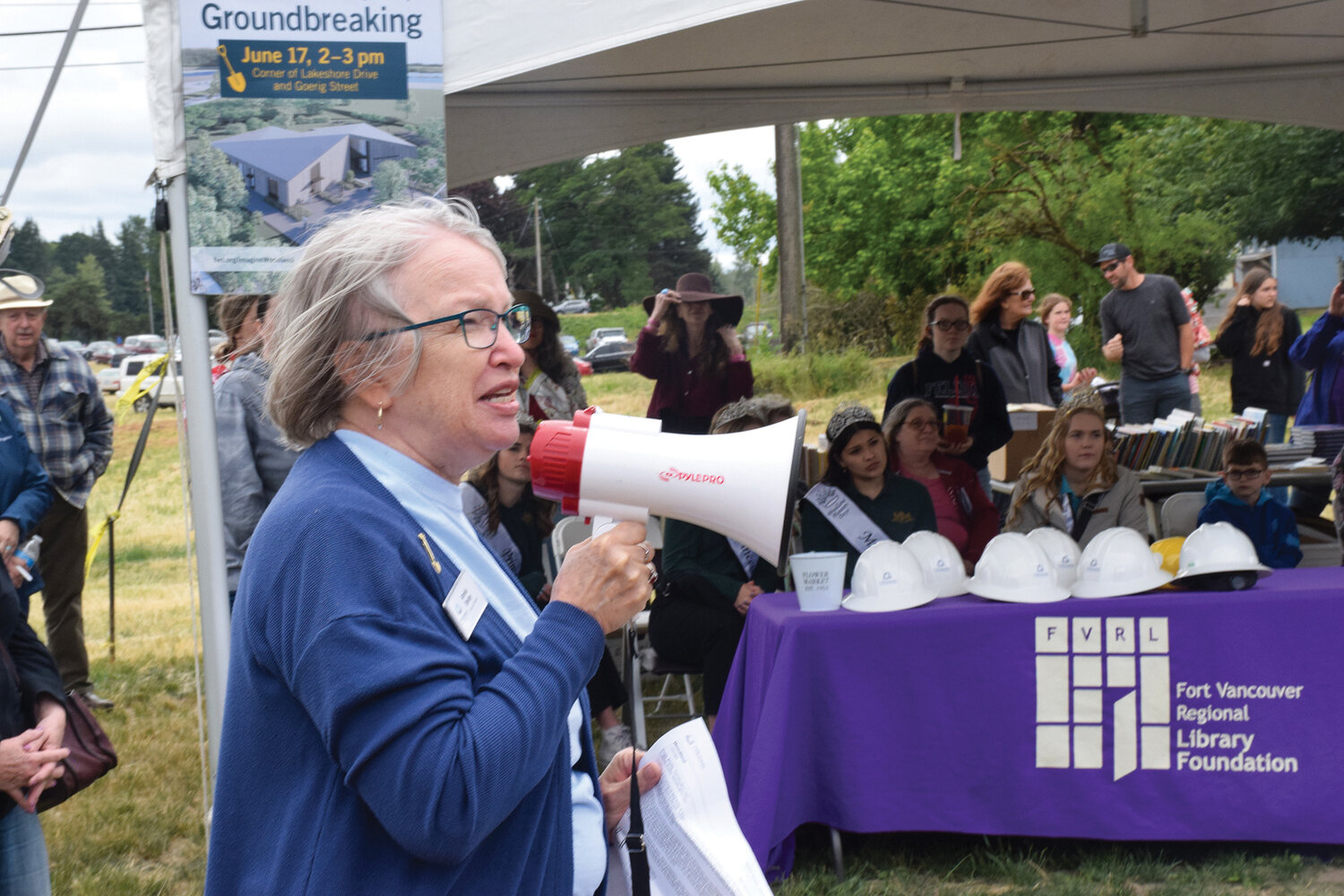 Amelia Shelley, the executive director of the Fort Vancouver Regional Library system, speaks among a crowd gathered for the groundbreaking of the Woodland Community Library on June 17.