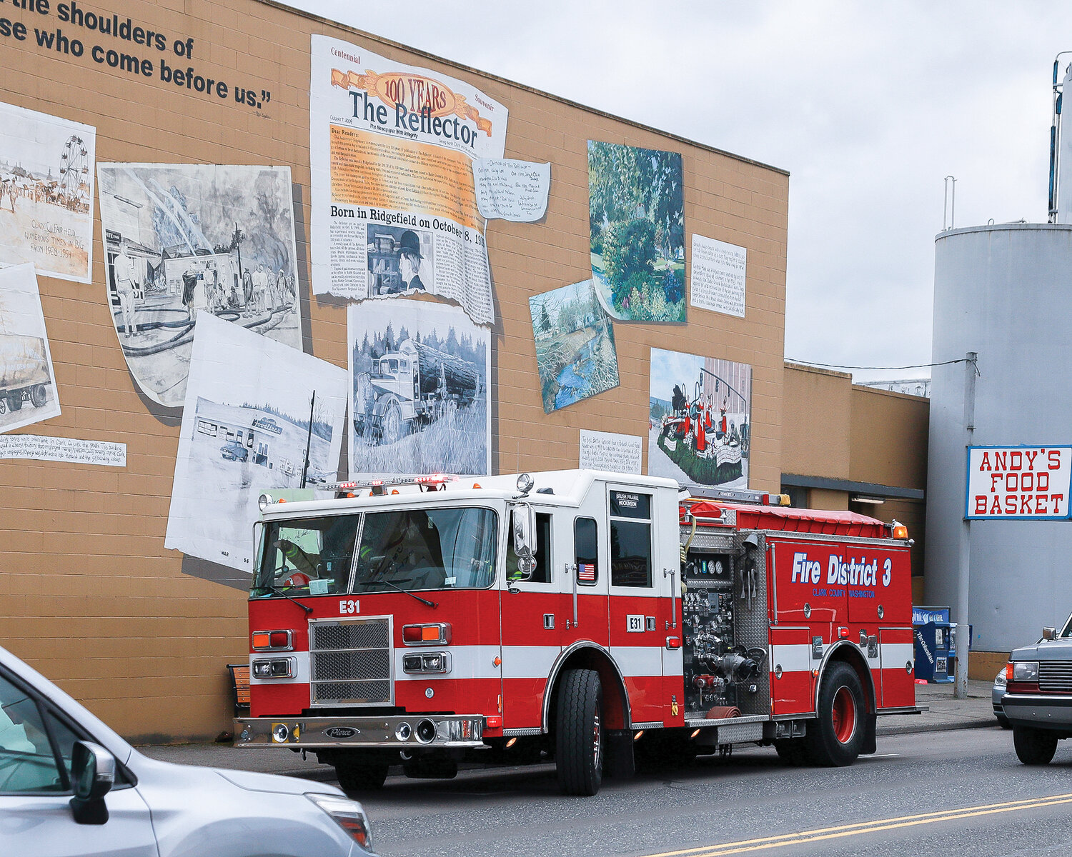 A Clark County Fire District 3 engine sits in front of the Battle Ground mural on Main Street.