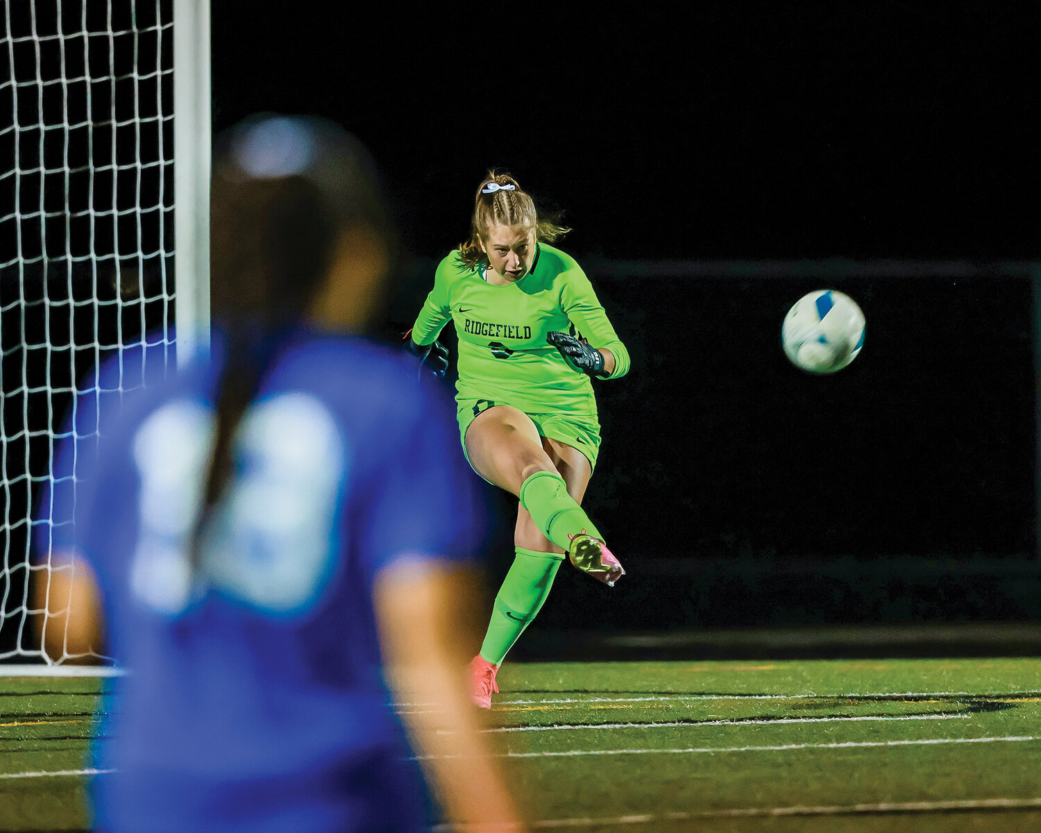 Spudders’ goalkeeper Tyler Merlock passes the ball down field during her seven-save shutout against Union in Ridgefield’s 2-0 non-league victory on Thursday, Sept. 7.