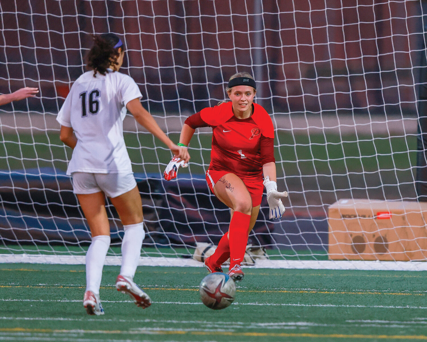 Prairie’s goalkeeper Lille Amies pushes forward on Heritage’s Kianna Tyler during the Timberwolves’ breakaway score in the first half of the Falcons’ 9-2 victory over Heritage High School on Thursday, Sept. 21.