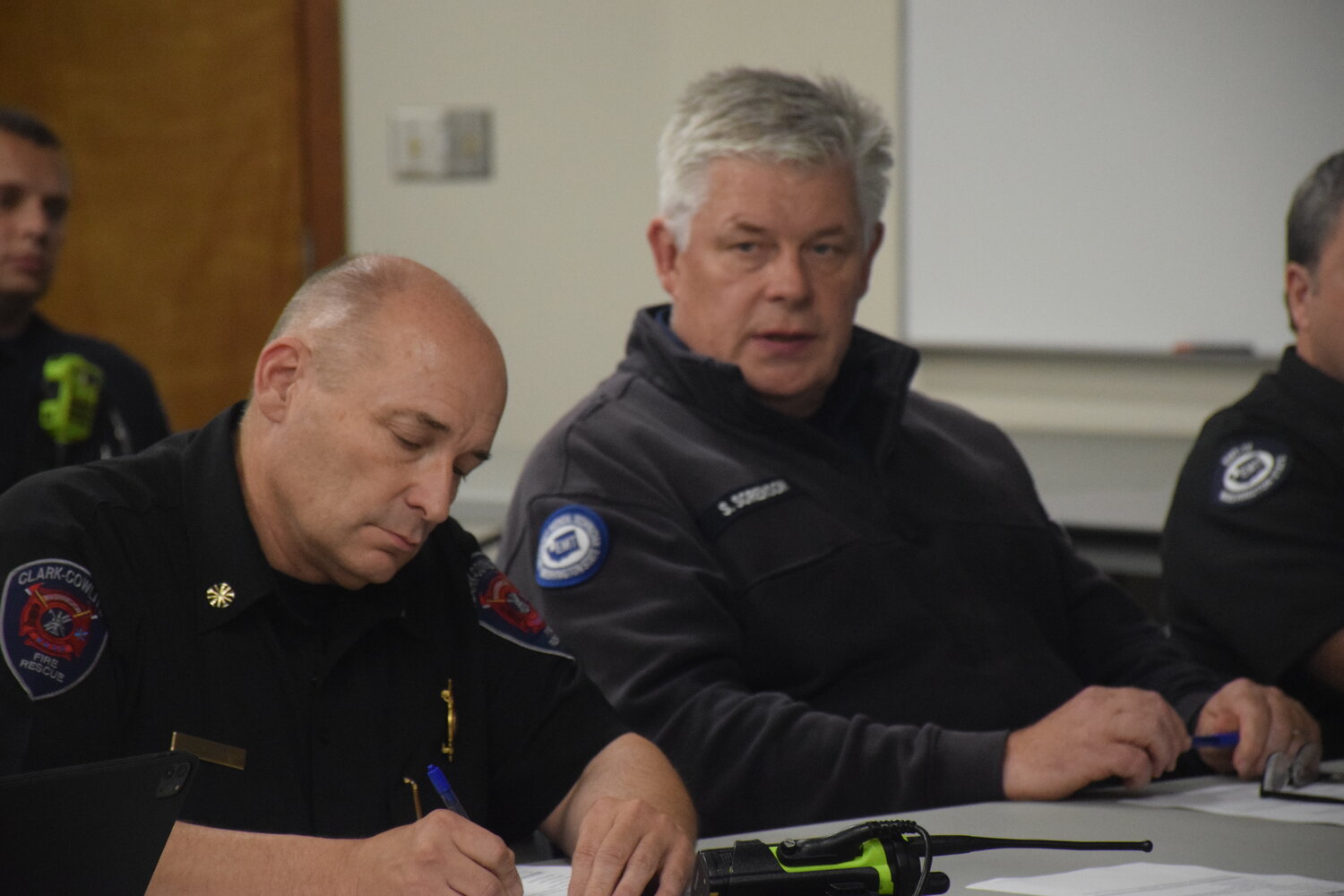 Clark-Cowlitz Fire Rescue Chief John Nohr, left, and Clark County Fire District 3 Chief Scott Sorenson take part in a joint-district meeting at CCFR’s Dollar’s Corner station Oct. 4.