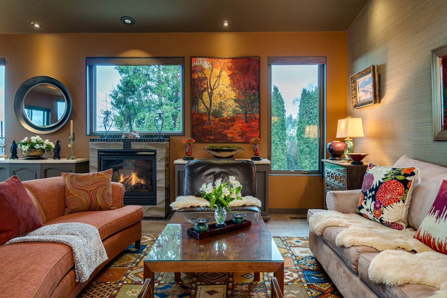 Orange and gold combined with some fuzzy sheep skins can make a space feel warm and soft.