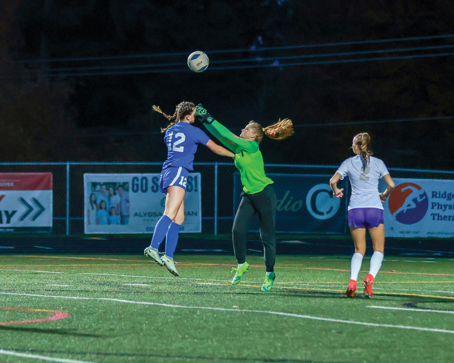 The Ridgefield Spudders’ Marlee Buffham battles for the ball against the Sequim Wolves’ goalkeeper in the first round of the 2A state playoffs on Wednesday, Nov. 8.