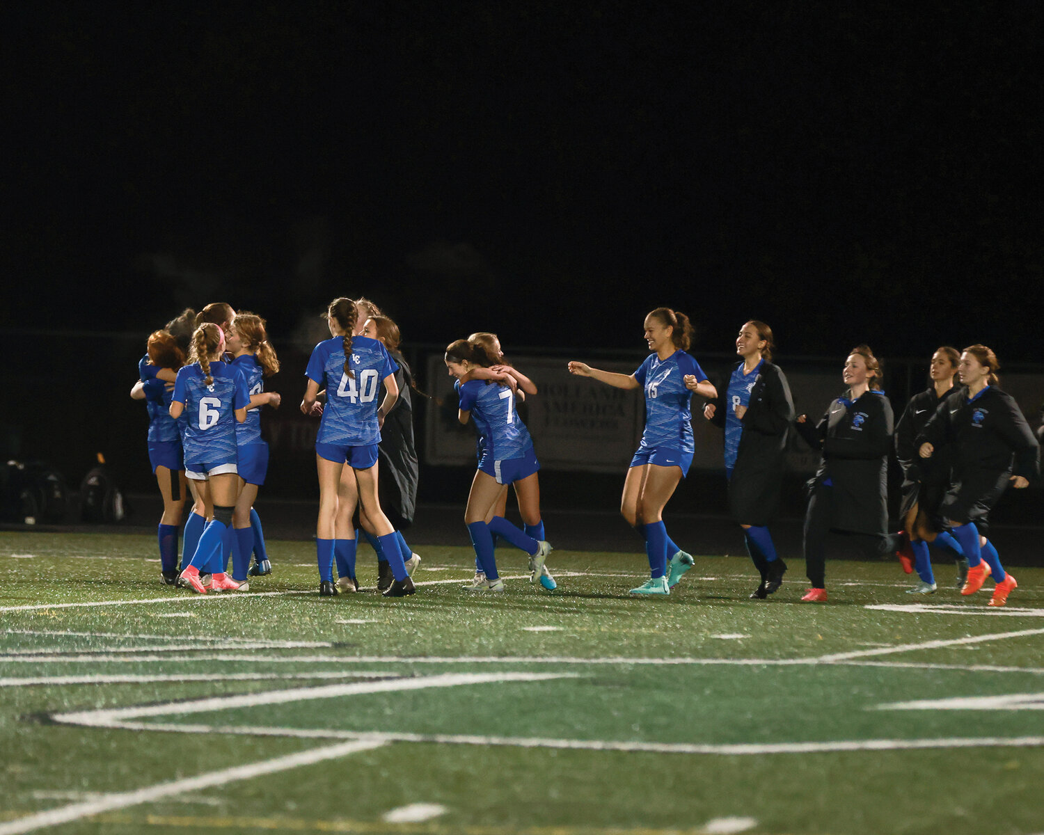 The La Center Wildcats girls soccer team celebrates its come-from-behind victory against Meridian High School in the first round of the 1A state playoffs on Wednesday, Nov. 8.