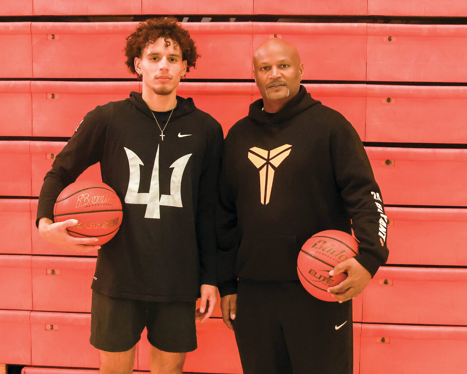Battle Ground basketball’s new father-son coaching duo: head coach Brett Johnson, right, brings years of experience while his son, Squeeky Johnson, brings post-college basketball knowledge to the Tigers.