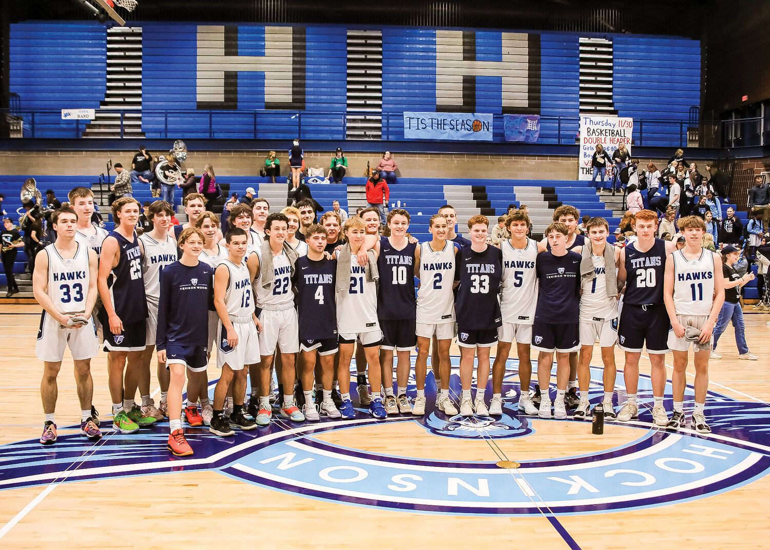 Players from both Tenison Woods of Australia and the Hockinson Hawks basketball teams stood together for photos after the game on Thursday, Nov. 30. 