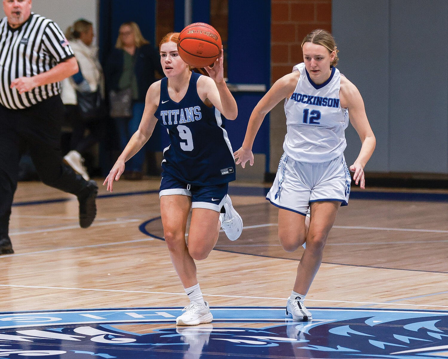 Tenison Woods’ Lillie Paul takes the ball upcourt with Hockinson’s Kathryn White defending during the exhibition match between the Hawks and the Tenison Woods Titans from Mount Gambier, Australia, on Thursday, Nov. 30.