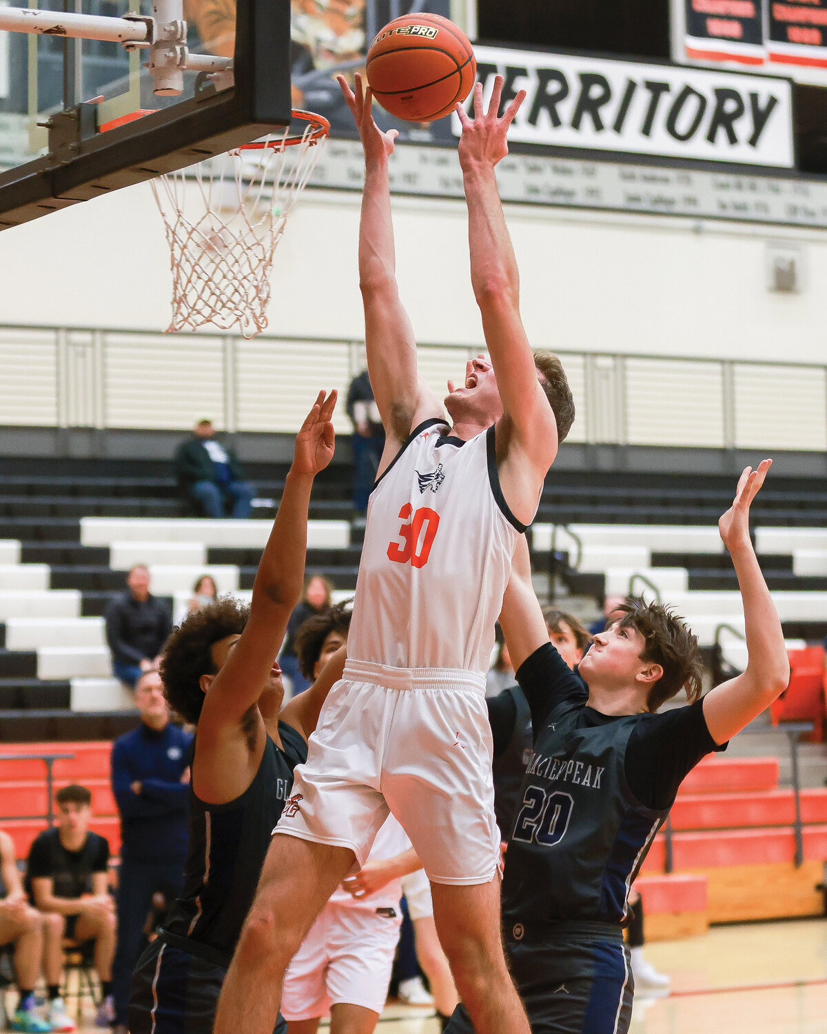 Battle Ground's Boston Walker drives into the lane in the Tigers’ third game of the week, which resulted in a 69-36 loss to Glacier Peak High School on Friday, Dec. 1.
