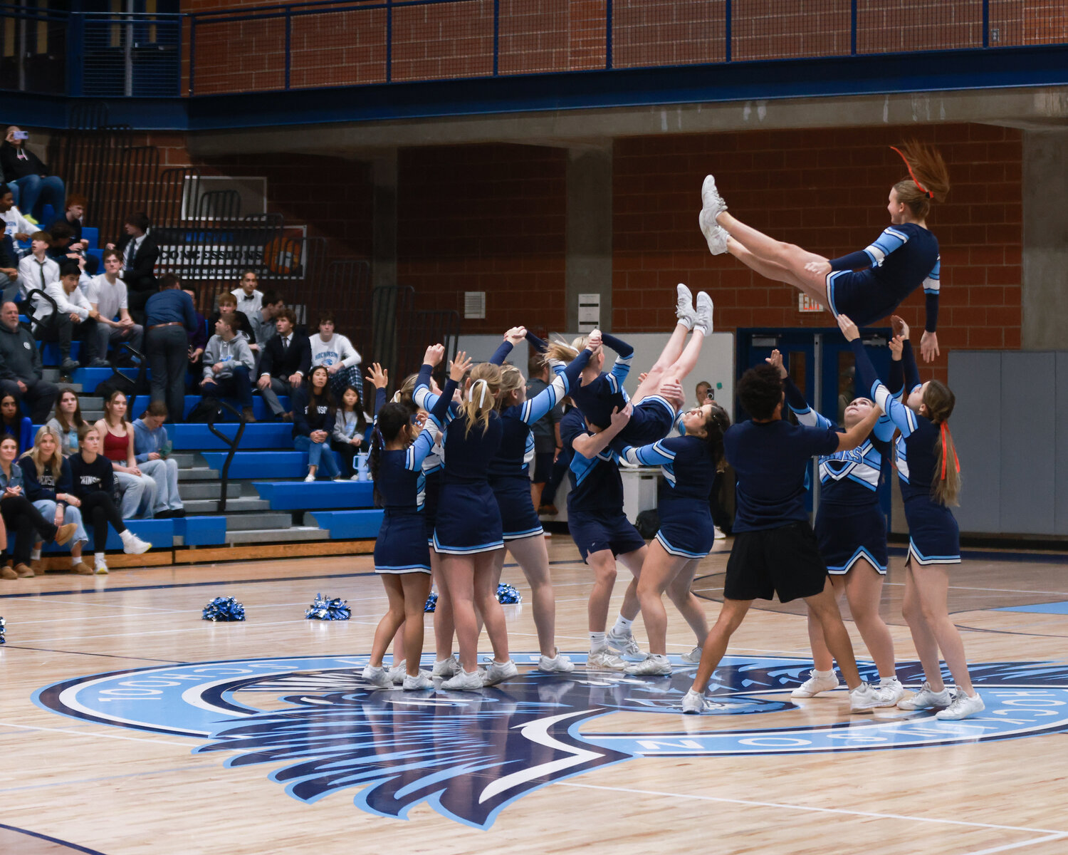 The Hockinson Hawks’ cheer squad performs during the two varsity basketball games against Tenison Woods College from Mount Gambier, Australia, on Thursday, Nov. 30. 
